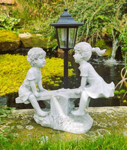 Load image into Gallery viewer, Solar Light Boy & Girl Seesaw Stone Effect Garden Ornament