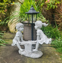 Load image into Gallery viewer, Solar Light Boy & Girl Seesaw Stone Effect Garden Ornament