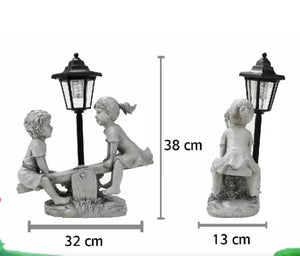 Solar Light Boy and Girl Seesaw Stone Effect Garden Ornament