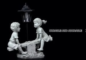 Solar Light Boy & Girl Seesaw Stone Effect Garden Ornament
